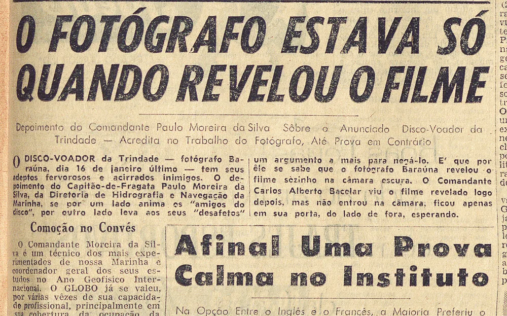 Yellowed Brazilian newspaper page with the large headline "O fotógrafo estava só quando revelou o filme" above columns of text about the Trindade Island photographs