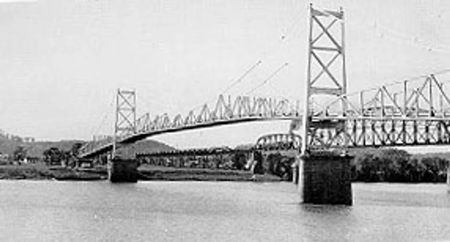 The Silver Bridge, an eyebar-chain suspension bridge, photographed intact over the Ohio River in 1928